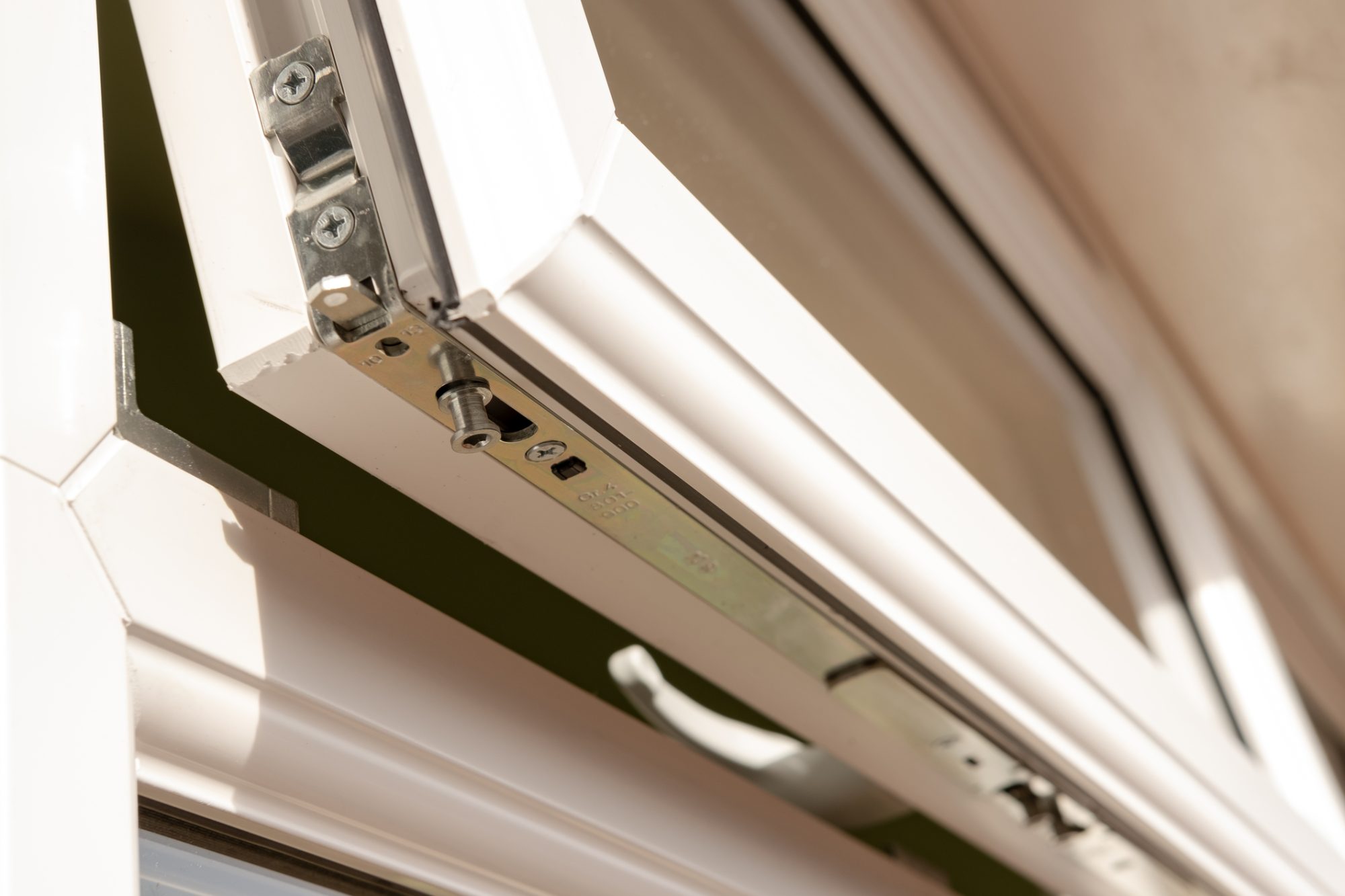 Close-up of a newly installed, high security double glazing window system. Details of the multiple latching system can be seen on this partially opened window.